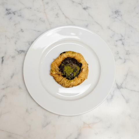 Chocolate Pistachio Cookie - White Plate Marble Background