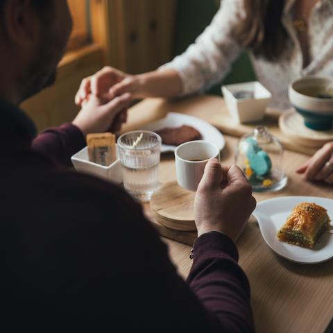 Couple on coffee date with baklava